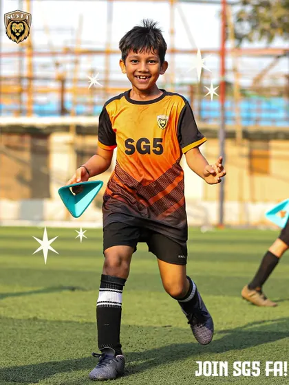 A young player running with a cone during a fun training drill. We believe that learning should be an enjoyable experience.