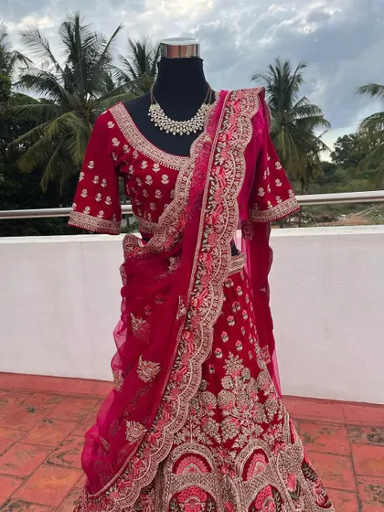 A full view of the stunning bridal lehenga on a mannequin, showcasing its royal design and craftsmanship.
