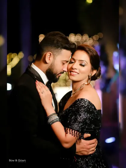 A beautiful, tender moment between the couple. Her eyes are closed as she leans into his embrace, a perfect picture of love and trust on their reception night.