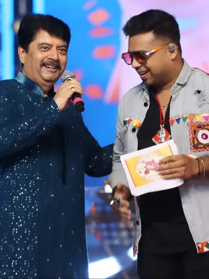 Sharing a moment on stage with a respected artist during the Prerna Raas Navratri event. Collaborating with such talented individuals is always a learning experience.