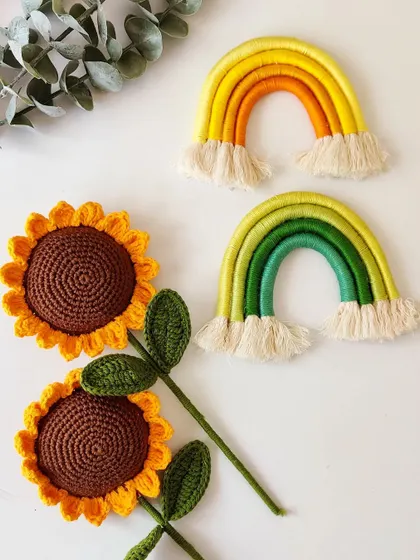 Sunflowers and rainbows, two of my favorite things to create. This combination of crochet flowers and macrame decor is sure to brighten any space.