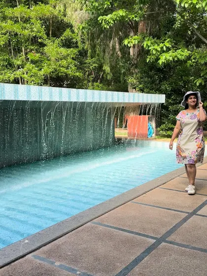 A guest walks by a beautiful water feature at our resort, adding to the tranquil and refreshing ambiance.