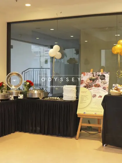 A buffet corner setup for a party, complete with a menu board and chafing dishes. We handle every aspect of the food service to ensure a flawless event.