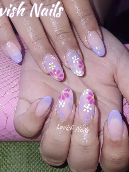 A delicate floral design with small, hand-painted daisies in pink, white, and purple on a sheer lilac base.