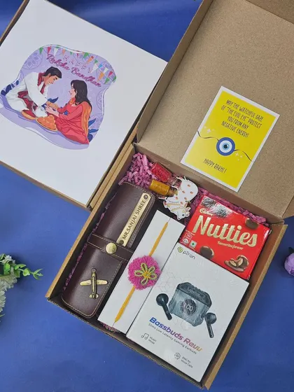A perfect Rakhi gift for a brother, this hamper includes a personalized wallet, wireless earbuds, chocolates, and a traditional rakhi with roli chawal, all packed in a custom-illustrated box.