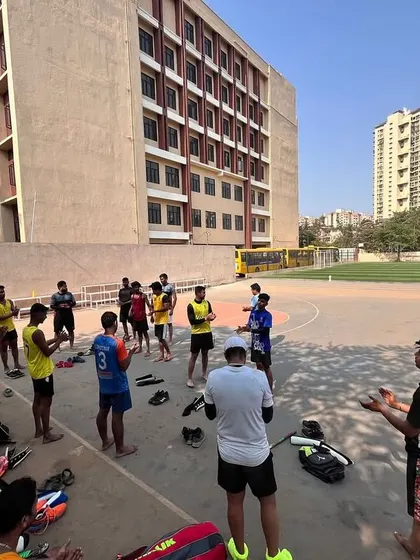 Our junior players gather for a pre-session briefing from the coach. We start every practice with clear objectives to ensure focused and productive training.
