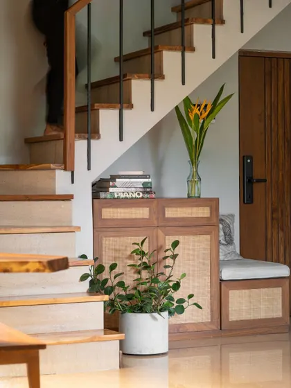 A detail of the shoe cabinet, which provides practical storage while adding to the home's aesthetic.