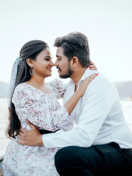 A sweet and intimate moment on a boat. The calm water and soft light make this a very romantic and peaceful portrait.