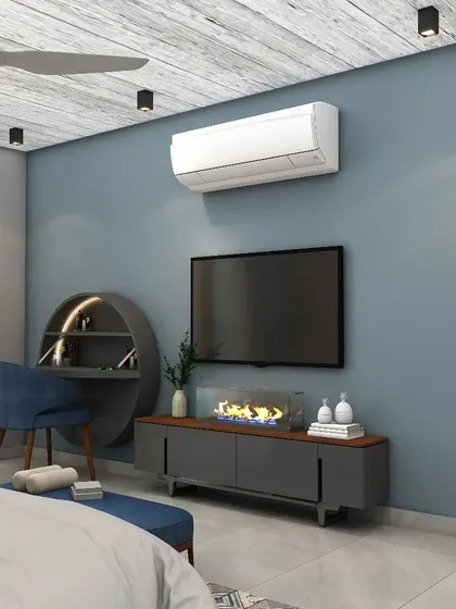 A unique circular dressing table and a modern fireplace are integrated into the TV unit, combining functionality with stylish design.