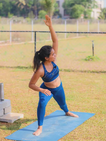 A yoga instructor holds a perfect pose during one of our wellness events at the camp.