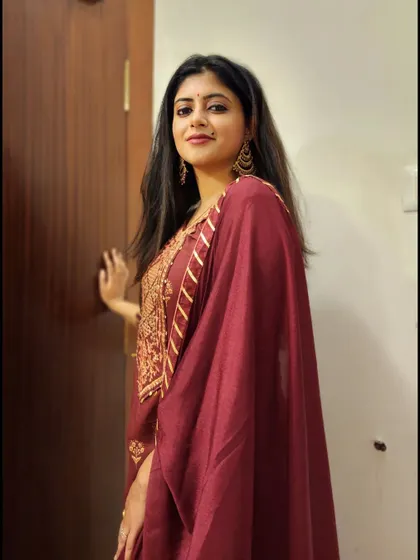 Another view of the maroon anarkali, showing the intricate embroidery on the yoke.