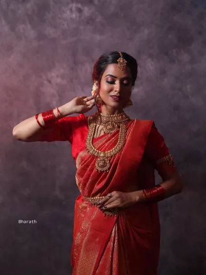 Using dramatic side lighting in the studio to create shadows and depth. This technique adds a moody and artistic feel to this traditional portrait.