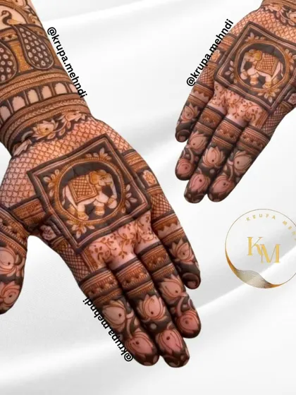 An elegant design featuring elephant and peacock motifs. This combination represents royalty and beauty, perfect for a bride-to-be.