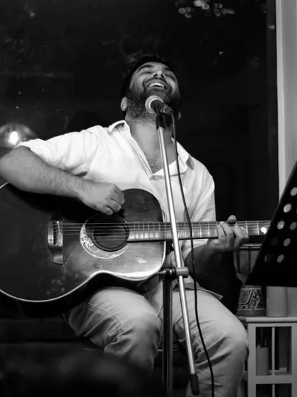 A black and white shot capturing the raw passion of a live performance. It's moments like these that remind us why we do what we do.
