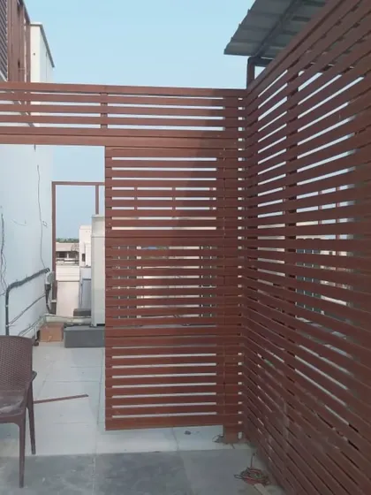 A rooftop utility area cleverly concealed with our louvered screens. This solution provides necessary ventilation for AC units while maintaining a clean and organized aesthetic.