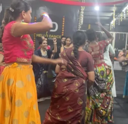 A circle of dancers enjoying a traditional Garba step. We create an authentic and immersive experience for all our festival events.