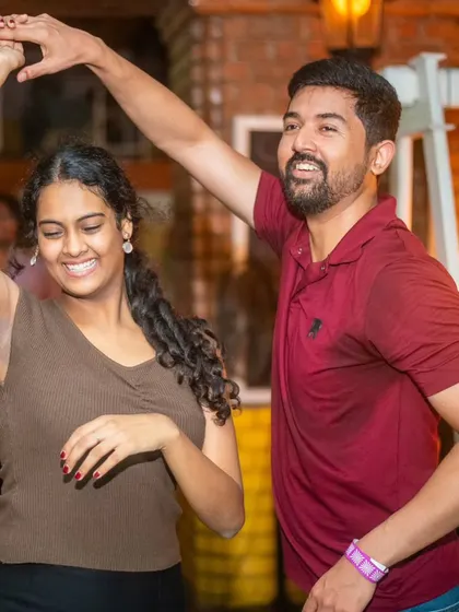 A perfect dip and a smile. Every dance is a conversation, and this one is speaking volumes of fun and connection.