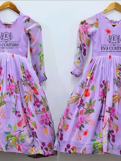 A pair of modern gowns for sisters, made from a lovely lavender floral georgette fabric. The dresses have long sleeves and a pleated skirt, perfect for parties.