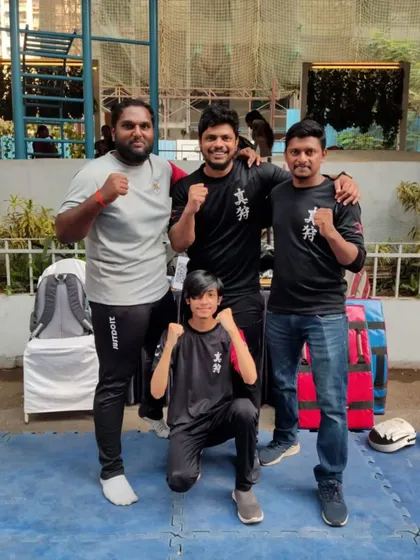 The Fighting Fit team, including a young warrior, after a successful event. We believe in starting them young.