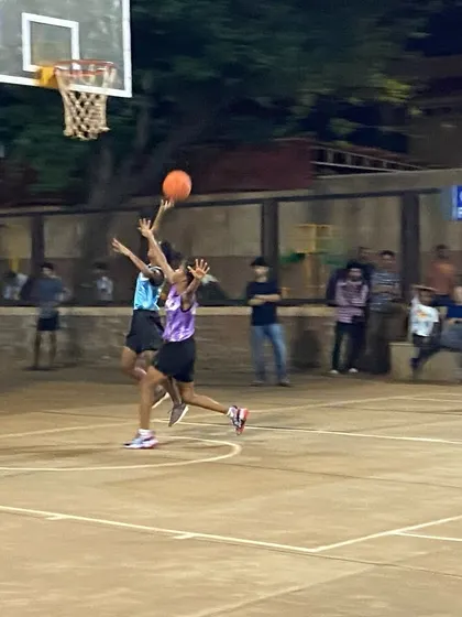 A contested layup during a women's eliminator match. Every basket matters when it's win or go home.