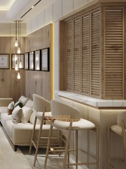 This view shows the integrated bar seating, which creates a casual social hub within the main living area. The louvered wood panel adds texture and visual interest.