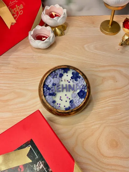 The "Behna" (sister) candle from my Rakhi collection, designed with lovely purple and blue wax flowers. It's a perfect way to show your sister some love.