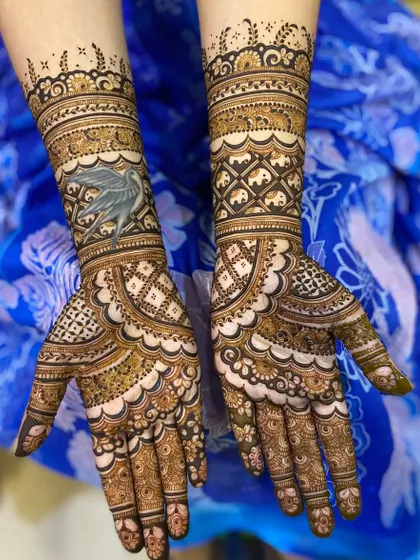 A unique bridal design featuring a custom bird motif on one arm, paired with a geometric pattern on the other.