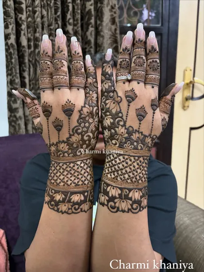 Blooming like a lotus, rooted in tradition. This back of hand design features delicate lotus buds on long stems, creating a graceful and modern look.