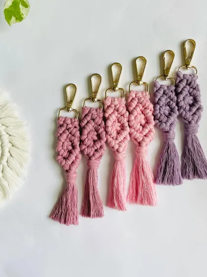 A collection of my boho-style keychains in dusty pink and purple shades. Personalized messaging is available for all gifting orders.