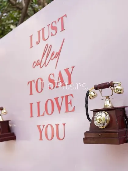 A detailed shot of the vintage telephones on the quirky and romantic photo wall.