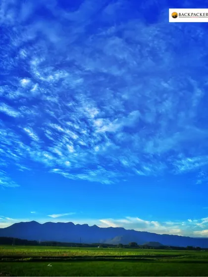 A breathtaking view of the sky and mountains on the way to Munnar.