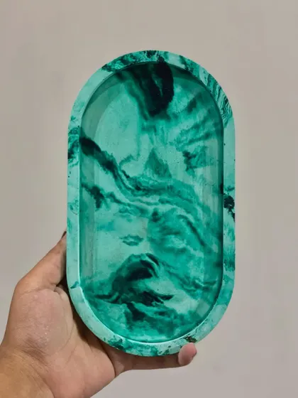 A perfectly marbled trinket tray in mint and viridian green. The swirling colors are so satisfying to look at.