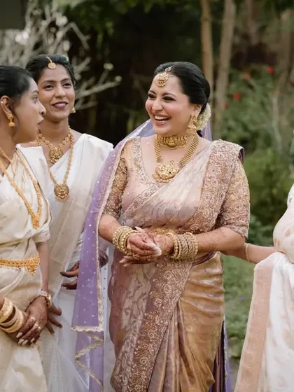 The bride sharing a moment of pure joy and laughter with her bridesmaids.
