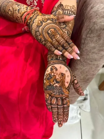A close-up of a romantic couple portrait on the palm, showcasing the delicate shading and emotional expression I can achieve with organic henna.