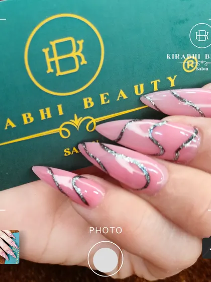 Another angle of the pink and silver swirl design, showing off the stiletto shape and glossy finish.