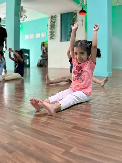 A happy dancer reaching for the sky. We celebrate every effort and encourage a positive mindset.