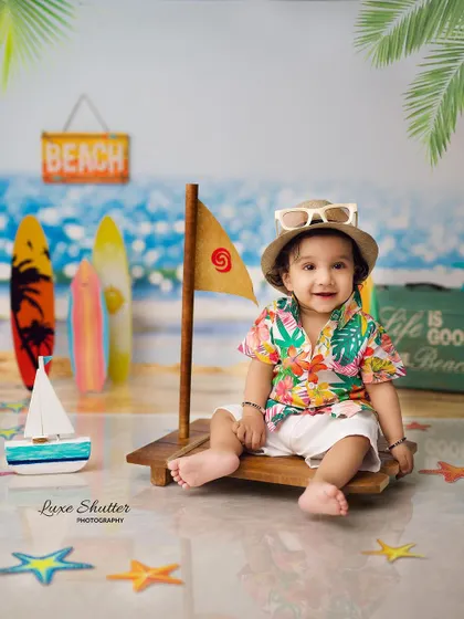 Another shot from our fun beach-themed session, this time with a cool hat and a happy smile.