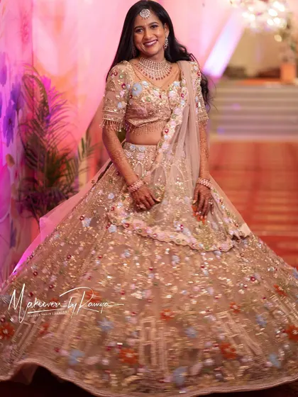 The bride twirling in her beautiful lehenga, a perfect shot for a reception album.
