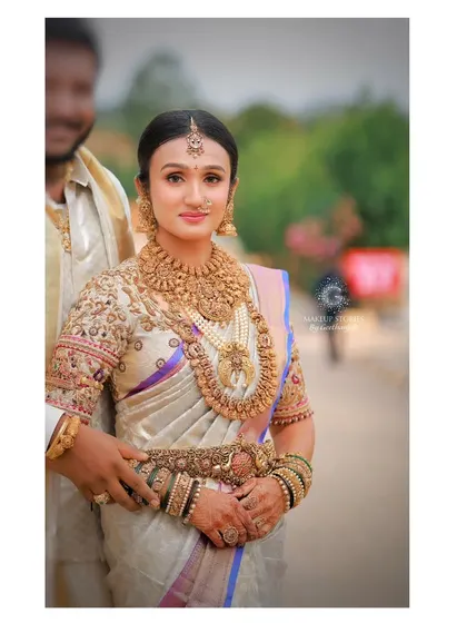 My bride, Dr. Vishnu Priya, looked like a goddess on her wedding day. Her radiant makeup and traditional attire created a vision of pure, timeless beauty.