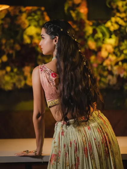 A view of the romantic, half-up hairstyle that perfectly complements the soft and pretty makeup.