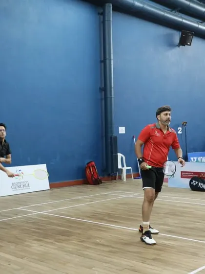 A doubles pair in action during the inter-club tournament. The image captures the dynamic movement and competitive spirit of the matches we organize.