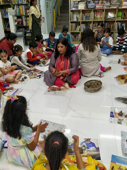 It's not just about listening to stories; it's about creating them too. Here, I'm guiding children as they make their own clay Ganeshas during our 'Ganpati ki Gaathayein' workshop. This hands-on activity helps them connect with the story on a deeper, more personal level.