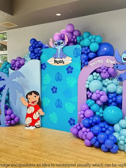 This Lilo & Stitch first birthday party features multiple backdrops and character cutouts, creating a layered and immersive tropical scene.