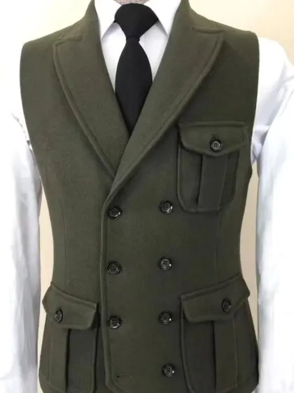 A close-up of a double-breasted waistcoat in olive green wool. The safari-style pockets give it a unique, rugged yet formal look.