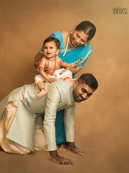 A playful take on a traditional theme. Little Krishna rides on his father's back like an elephant, while his mother looks on with love and laughter.