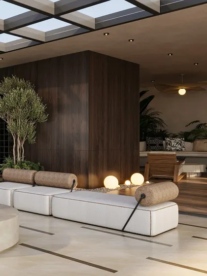Lush greenery and warm, spherical floor lamps are integrated into the terrace design, softening the architecture and creating a magical ambiance at dusk. The dark wood paneling adds a sense of warmth and enclosure.