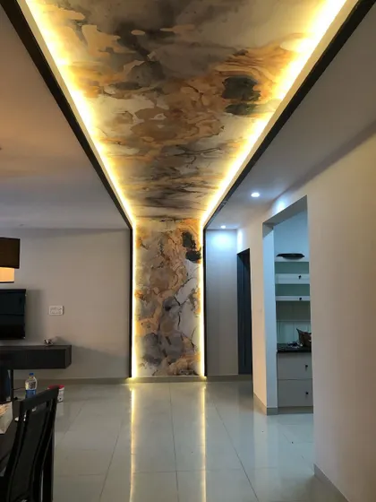 This shot captures the length of the hallway and the continuous flow of the wallpaper design.