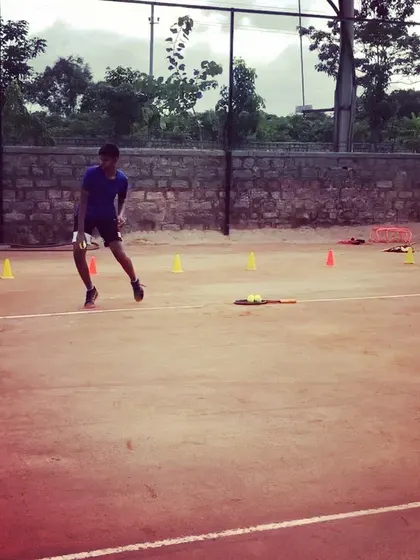 A student focuses on lateral movement during an agility exercise.