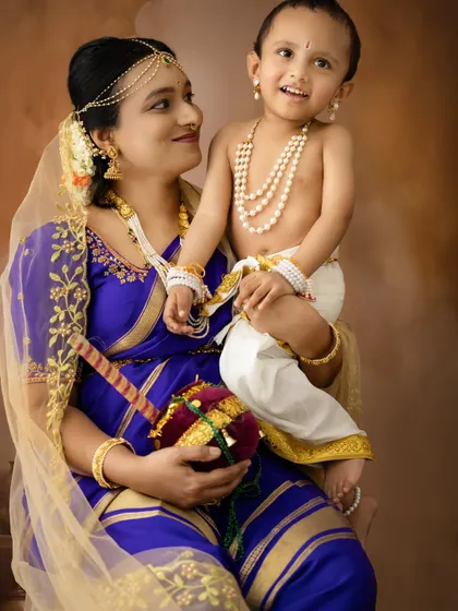 A different color palette for a Yashoda and Krishna shoot, with the mother in a beautiful blue saree.