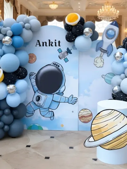 Blast off into fun with a space-themed birthday party. For Ankit's celebration, I designed a complete astronaut setup with a large backdrop, planet cutouts, a silver moon, and balloon garlands that look like galaxies.